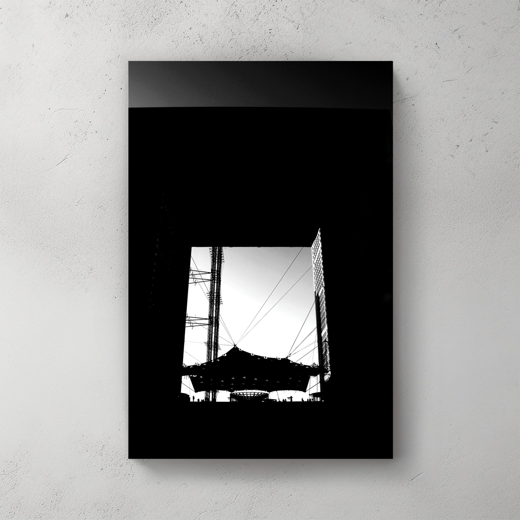 Bold black-and-white silhouette looking up through the Grande Arche at La Defense, cabled canopy below — canvas wall art print