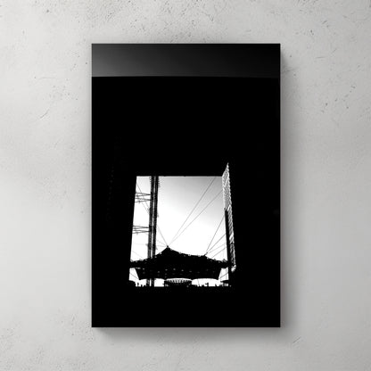Bold black-and-white silhouette looking up through the Grande Arche at La Defense, cabled canopy below — canvas wall art print