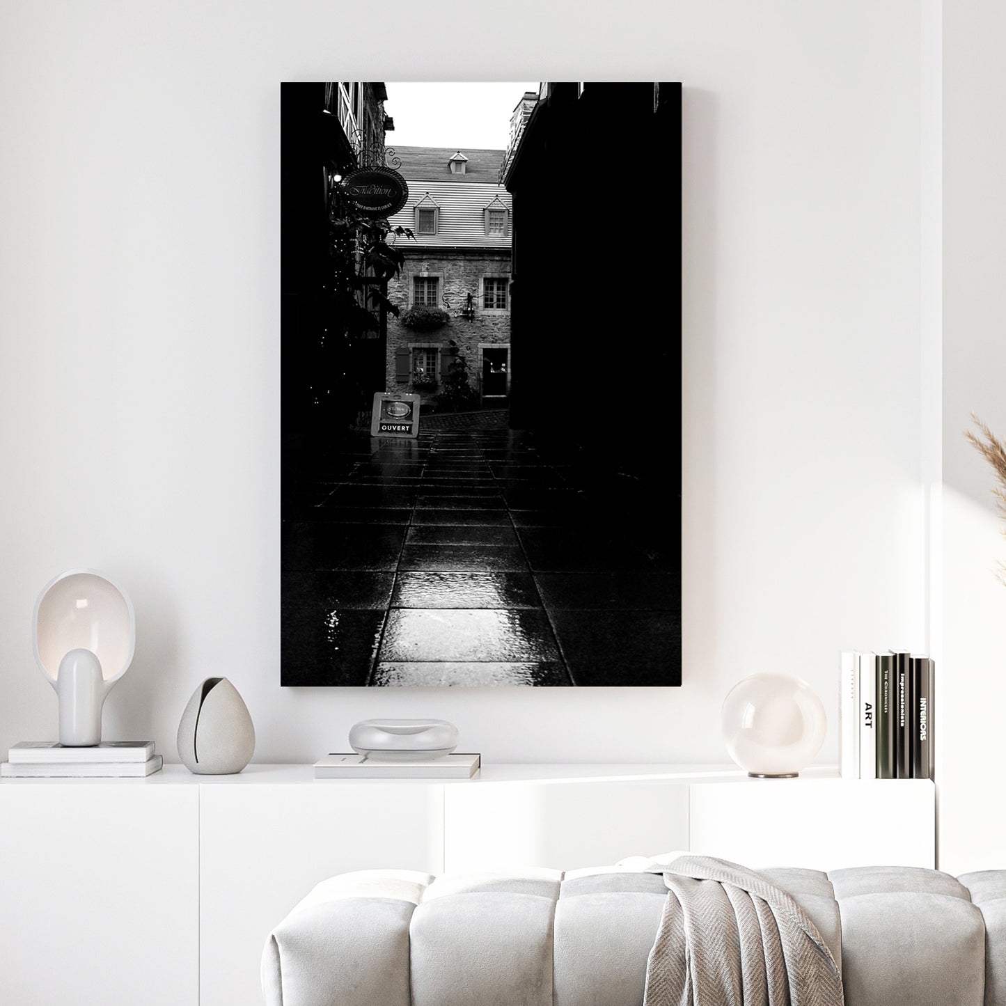 Old Quebec Alley canvas wall art print above a sofa in a contemporary living room