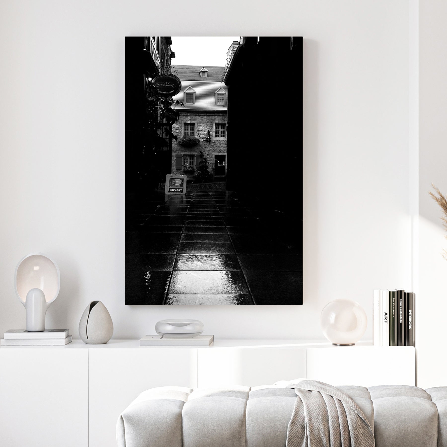 Old Quebec Alley canvas wall art print above a sofa in a contemporary living room
