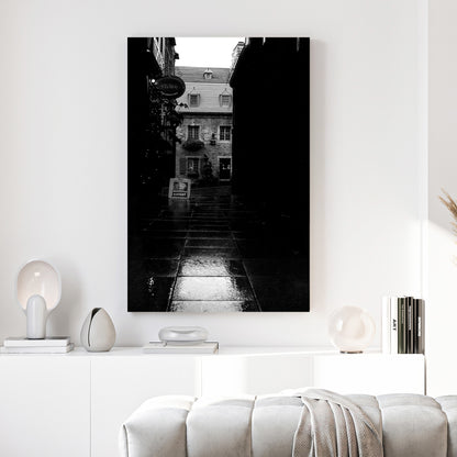 Old Quebec Alley canvas wall art print above a sofa in a contemporary living room