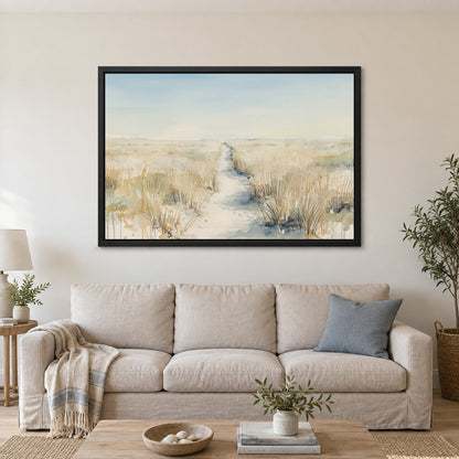 Sandy Dune Path Coastal framed canvas in a black floating frame above a linen sofa with a blue cushion