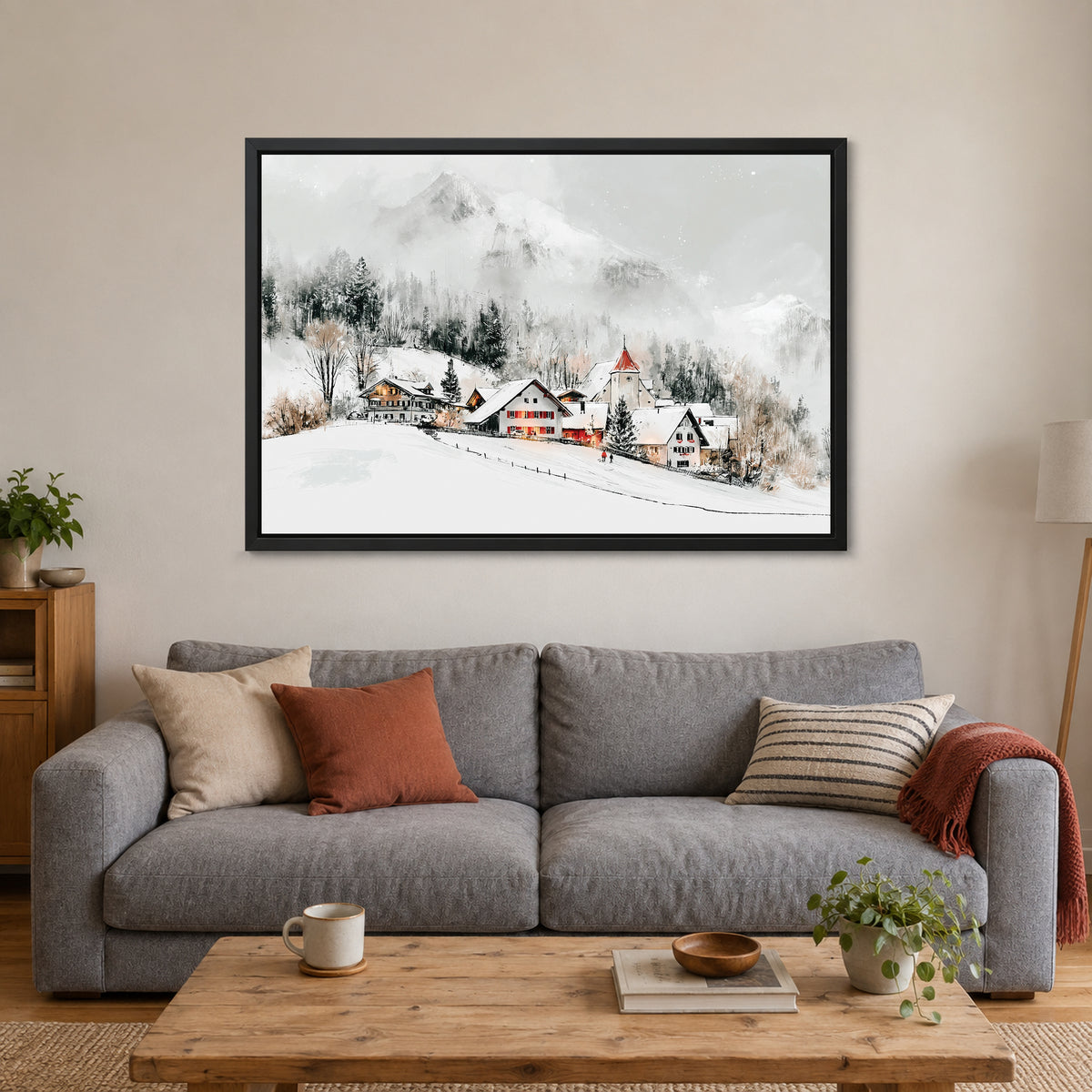 Swiss Alps Winter Chalets framed canvas in a black floating frame above a grey sofa with rust and striped cushions