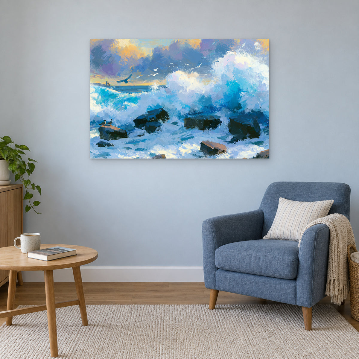 Crashing Ocean Waves Gold Sunset canvas wall art above a blue armchair and round wooden side table in a reading corner