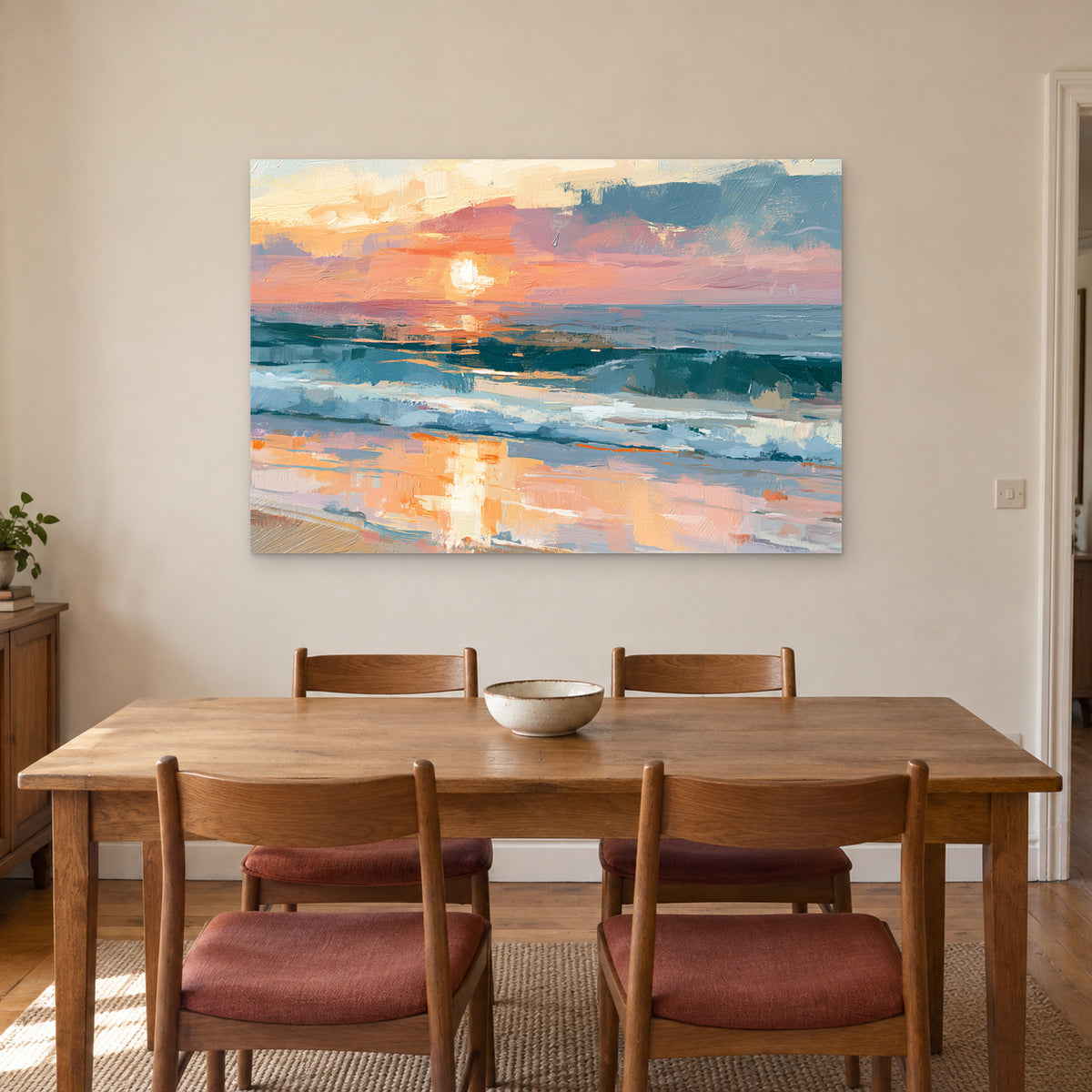 Ocean Sunset Wet Sand canvas wall art above a wooden dining table with rust-cushioned chairs
