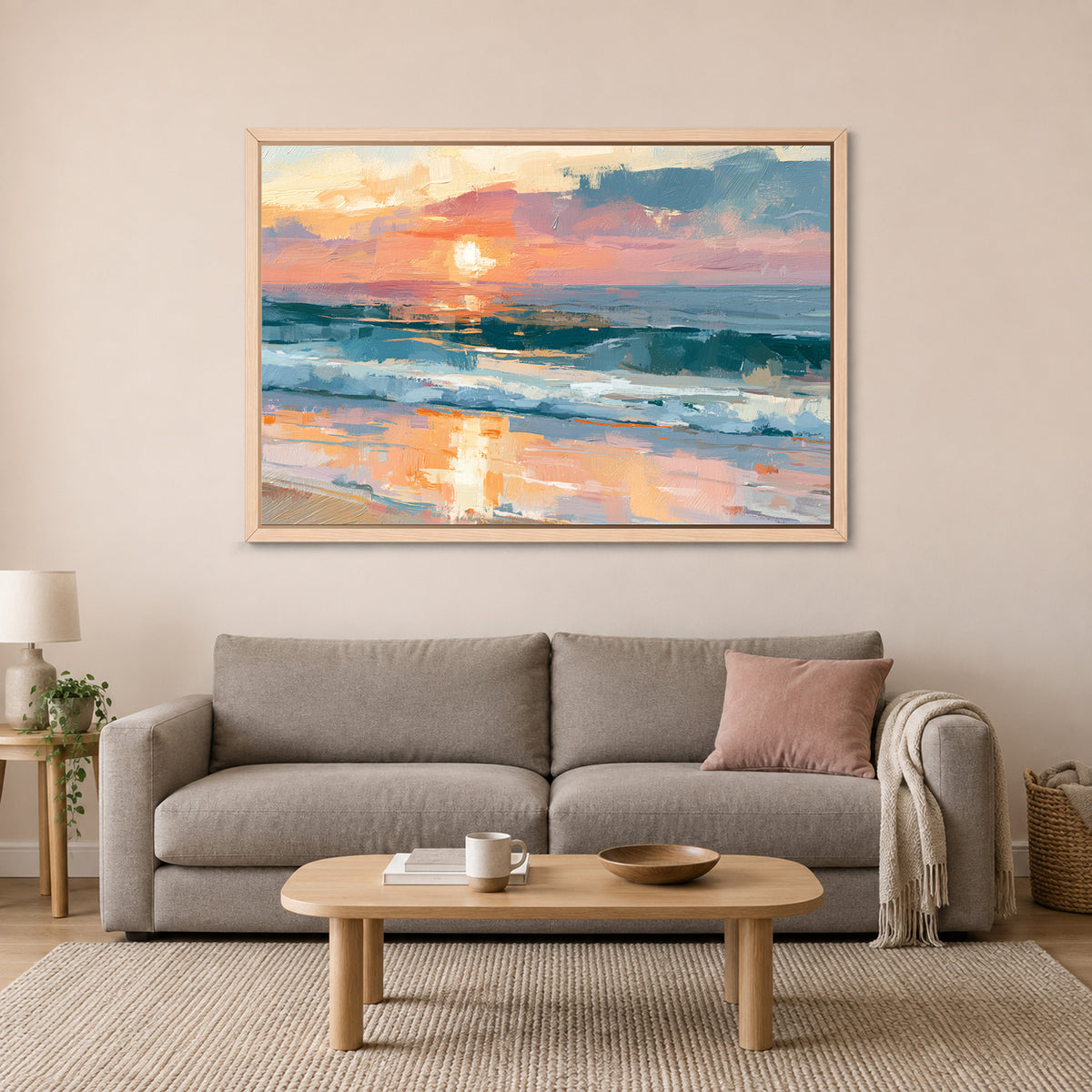 Ocean Sunset Wet Sand framed canvas in a natural wood floating frame above a taupe sofa on a blush wall