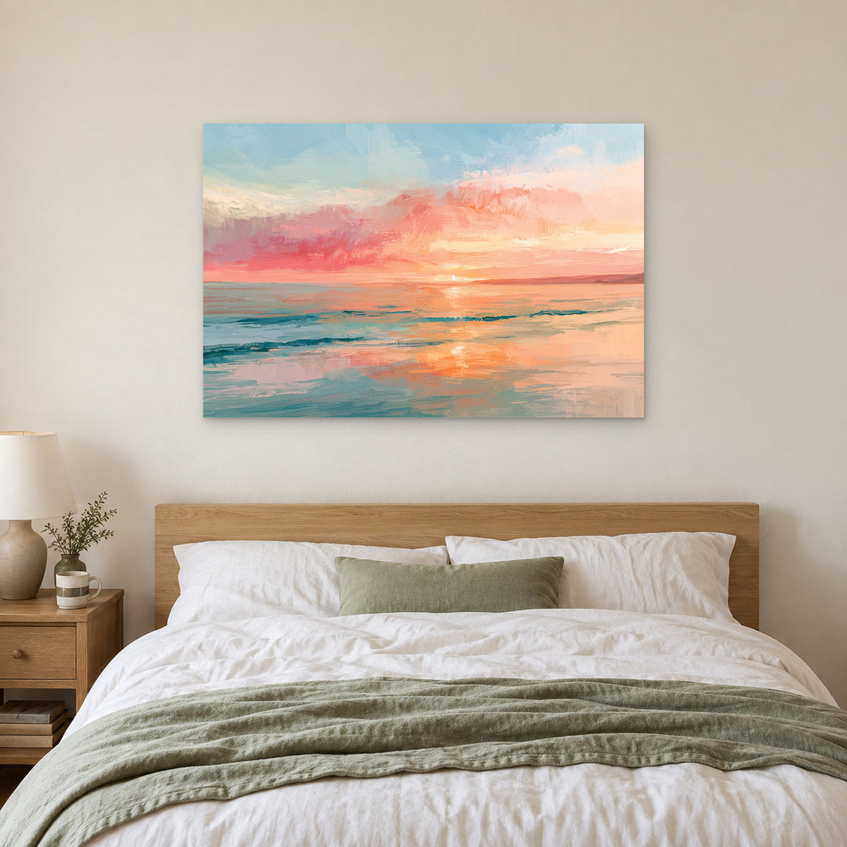 Calm Ocean Pink Sunset canvas wall art above a bed with white linens and a sage throw