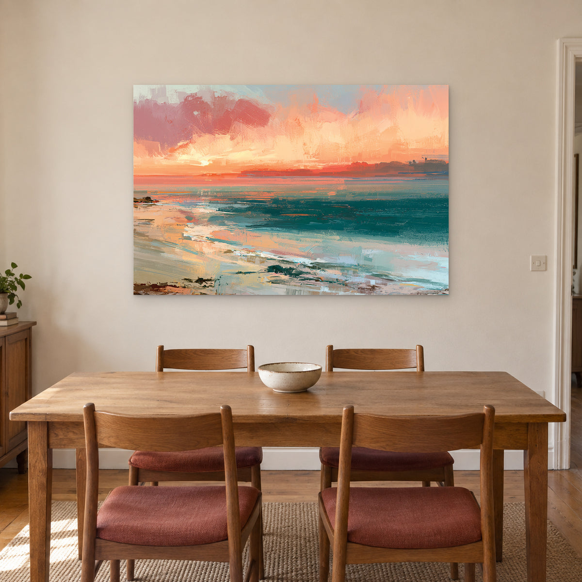 Curving Shoreline Sunset canvas wall art above a wooden dining table with rust-cushioned chairs