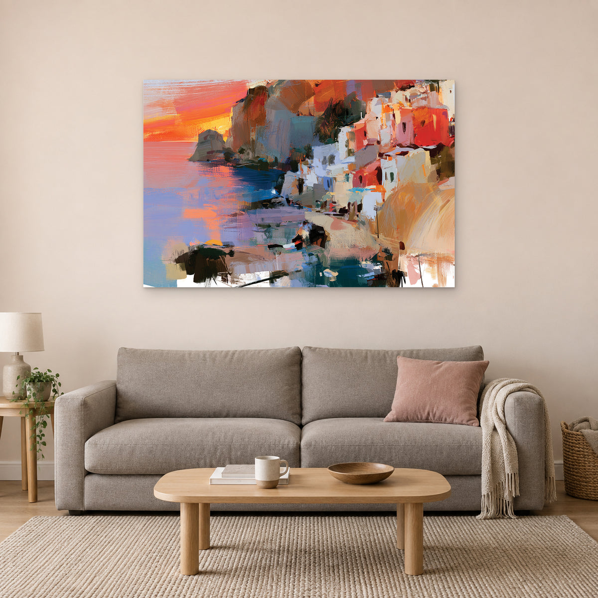 Coastal Town Sunset Headland canvas wall art above a taupe sofa on a blush wall