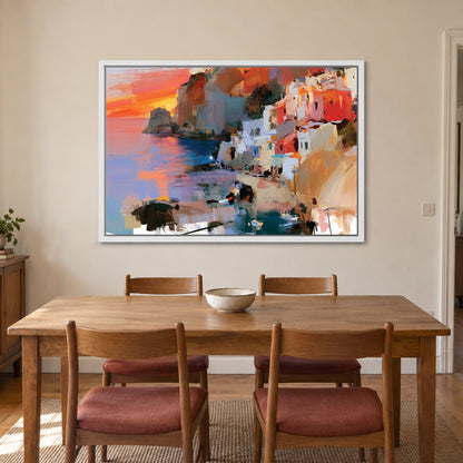 Coastal Town Sunset Headland framed canvas in a white floating frame above a wooden dining table with rust-cushioned chairs
