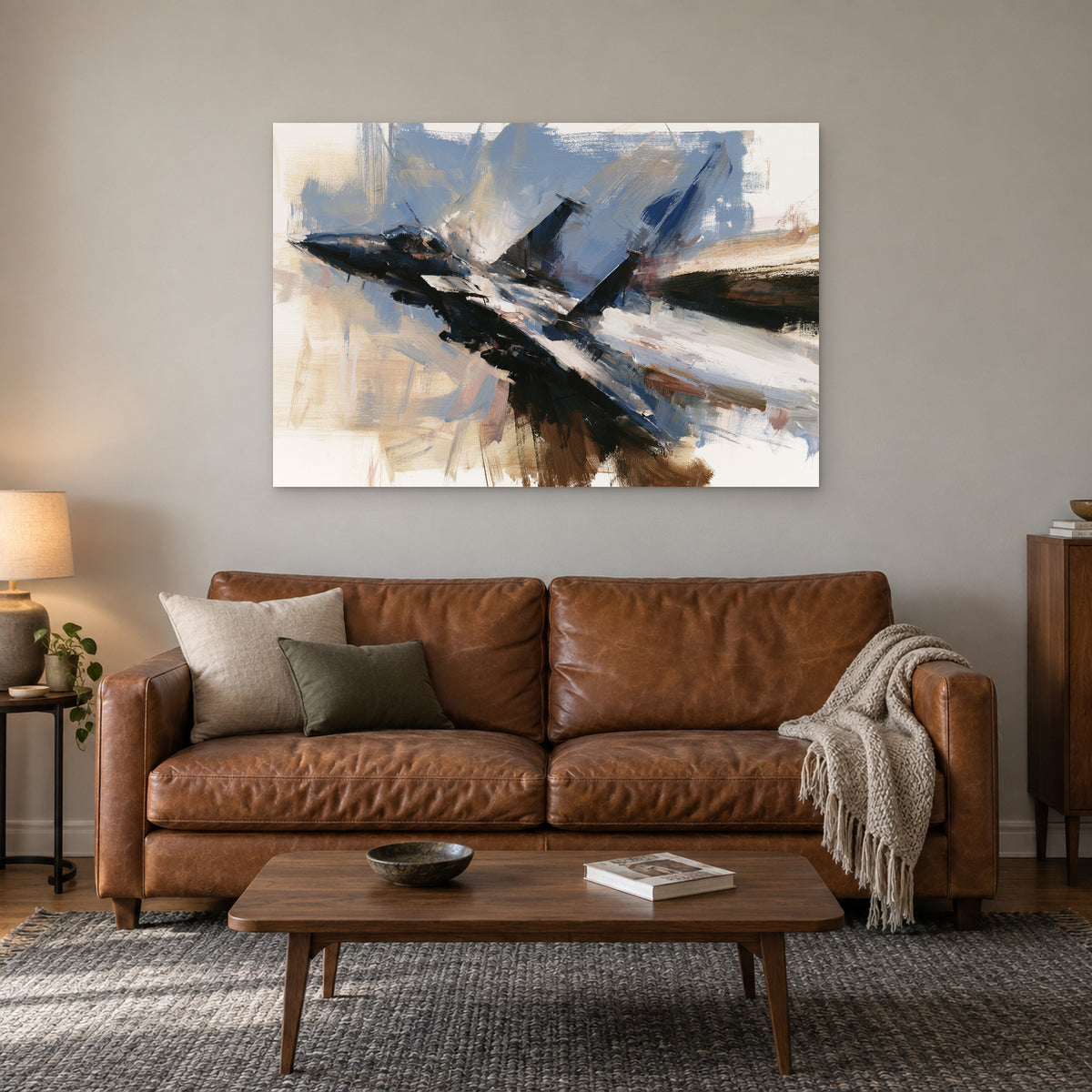 Fighter Jet Head-On Flight canvas wall art above a cognac leather sofa with a wooden coffee table