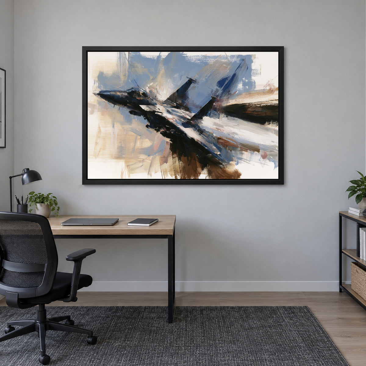Fighter Jet Head-On Flight framed canvas in a black floating frame above a light wood desk with a black office chair in a home office