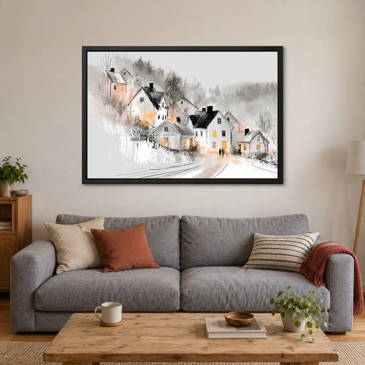 Finland Winter Dusk Cottages framed canvas in a black floating frame above a grey sofa with rust and striped cushions