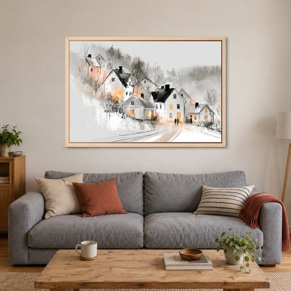 Finland Winter Dusk Cottages framed canvas in a natural wood floating frame above a grey sofa with rust and striped cushions