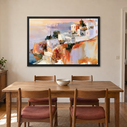Greek Island Cliff Town framed canvas in a black floating frame above a wooden dining table with rust-cushioned chairs