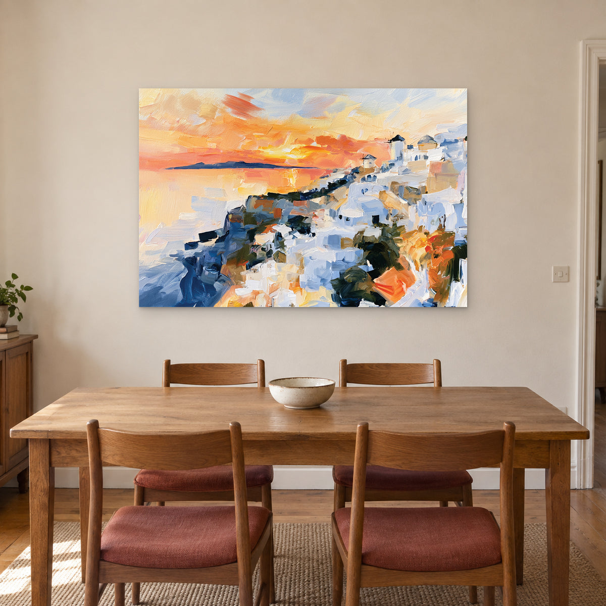 Greek Island Windmills Sunset canvas wall art above a wooden dining table with rust-cushioned chairs