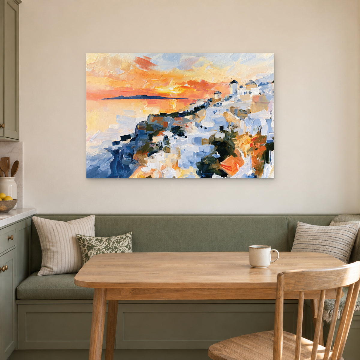 Greek Island Windmills Sunset canvas wall art above a green banquette and wooden table in a breakfast nook
