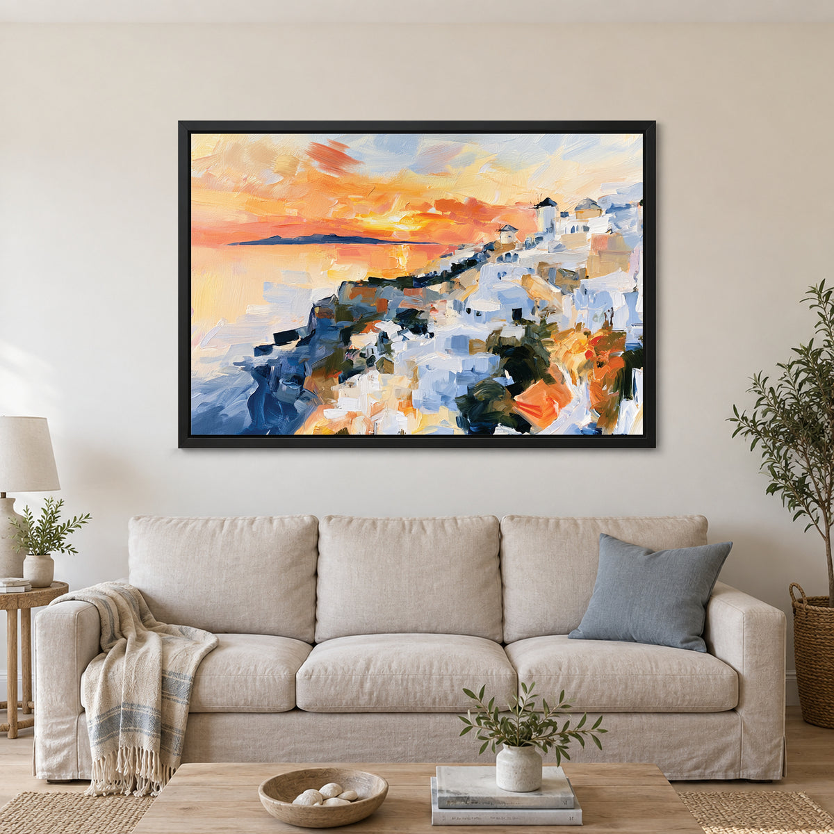 Greek Island Windmills Sunset framed canvas in a black floating frame above a linen sofa with a blue cushion