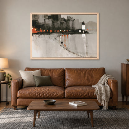 Harbour Lighthouse Night Lights framed canvas in a natural wood floating frame above a cognac leather sofa with a wooden coffee table