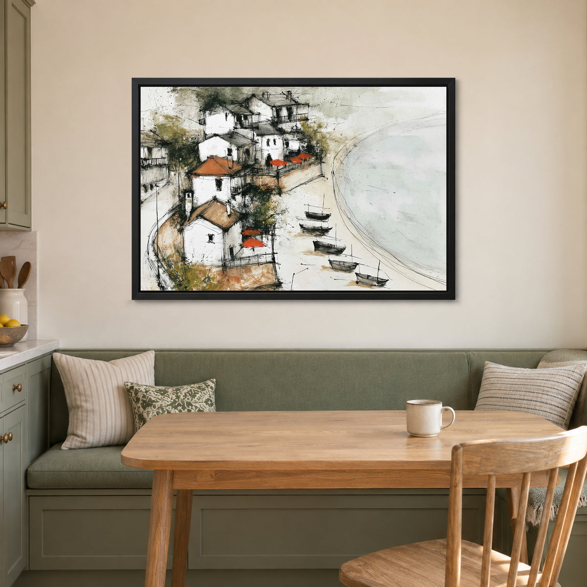 Mediterranean Fishing Boats Coastal framed canvas in a black floating frame above a green banquette and wooden table in a breakfast nook