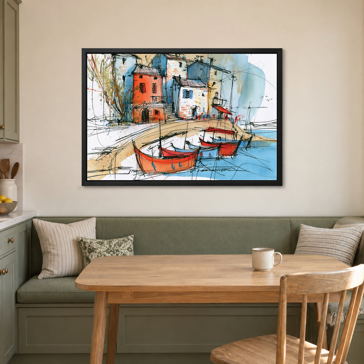 Red Fishing Boats Harbour framed canvas in a black floating frame above a green banquette and wooden table in a breakfast nook