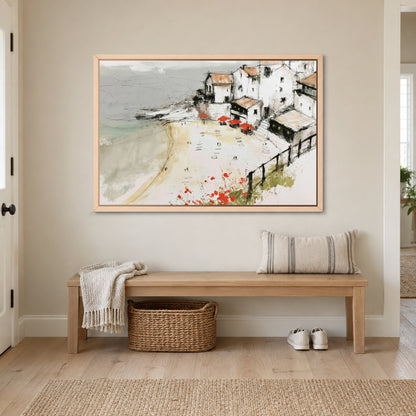Clifftop Town Red Parasols framed canvas in a natural wood floating frame above a wooden entryway bench with a woven basket