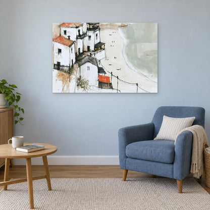 Whitewashed Headland Beach canvas wall art above a blue armchair and round wooden side table in a reading corner