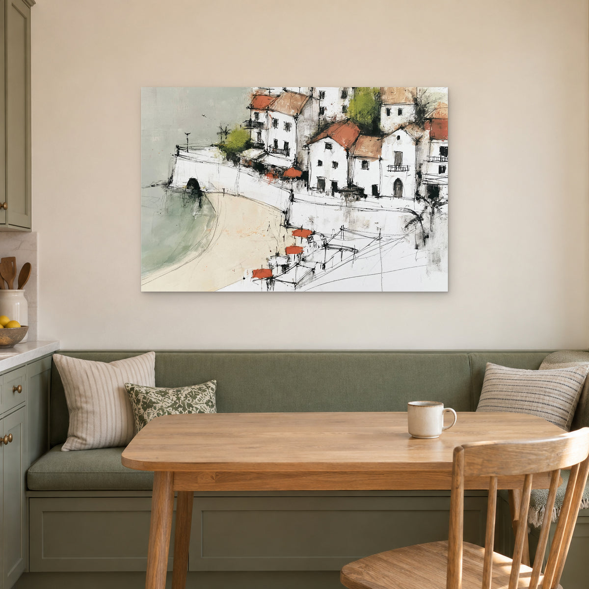 Whitewashed Coastal Town Bay canvas wall art above a green banquette and wooden table in a breakfast nook
