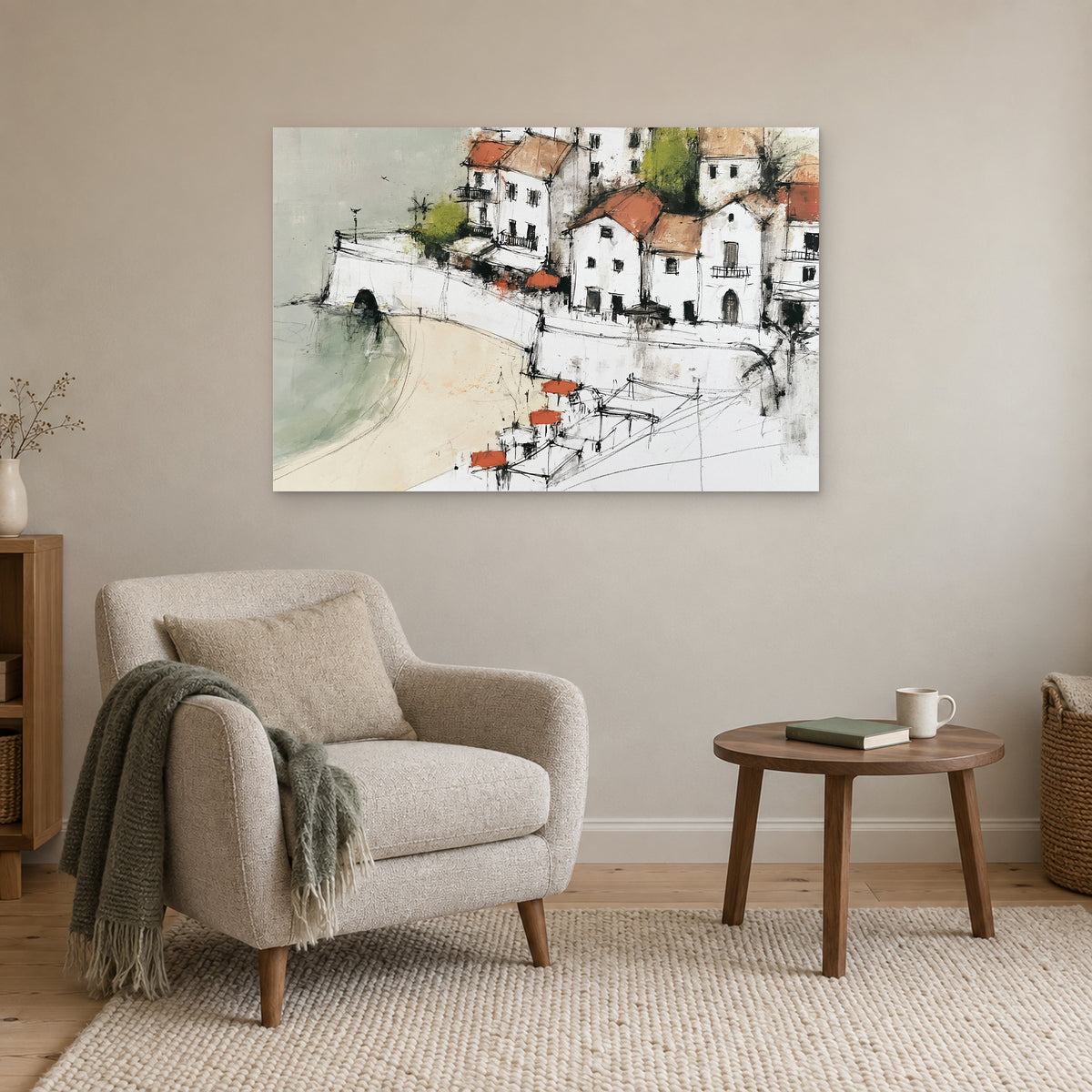 Whitewashed Coastal Town Bay canvas wall art above a cream armchair and round wooden side table
