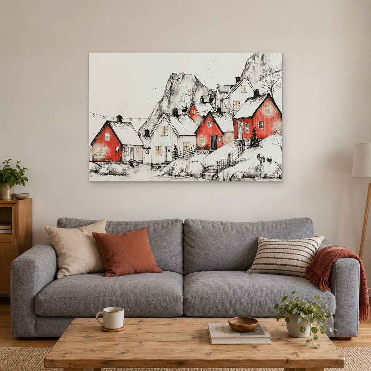 Norwegian Red Cabins Snow canvas wall art above a grey sofa with rust and striped cushions