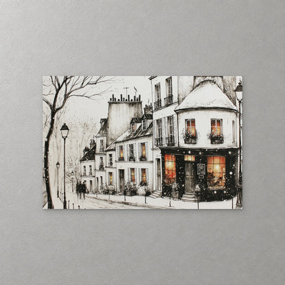 A Paris corner shop glows orange in the snow below white townhouses, with a bare tree, a street lamp and a couple walking, in black ink with warm lit windows — canvas wall art print