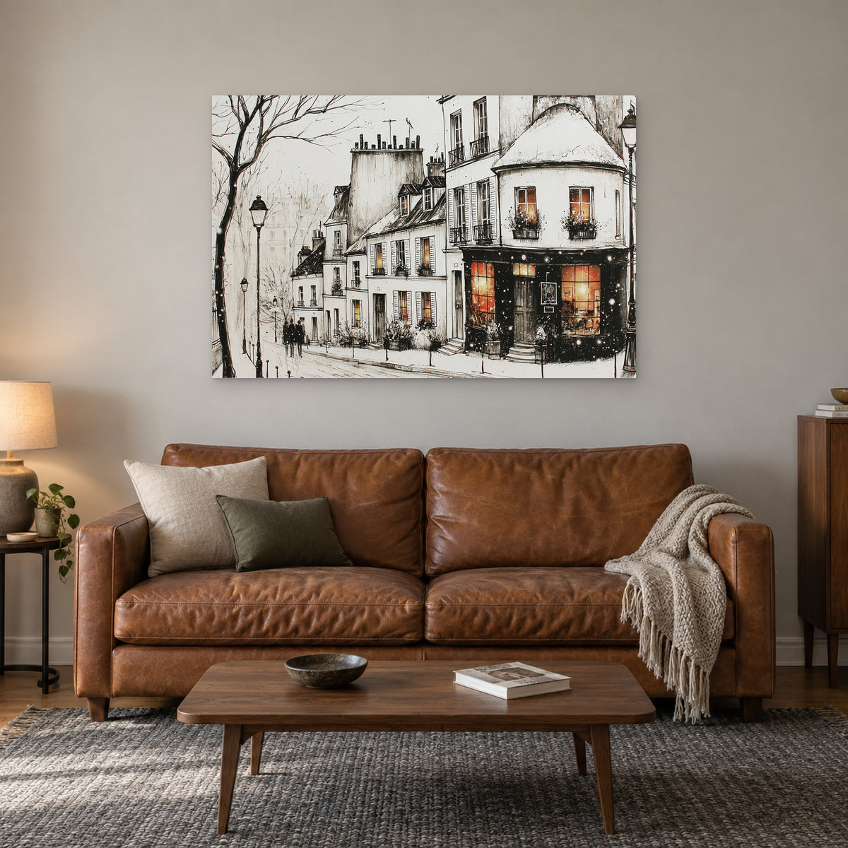 Paris Corner Shop Snow canvas wall art above a cognac leather sofa with a wooden coffee table