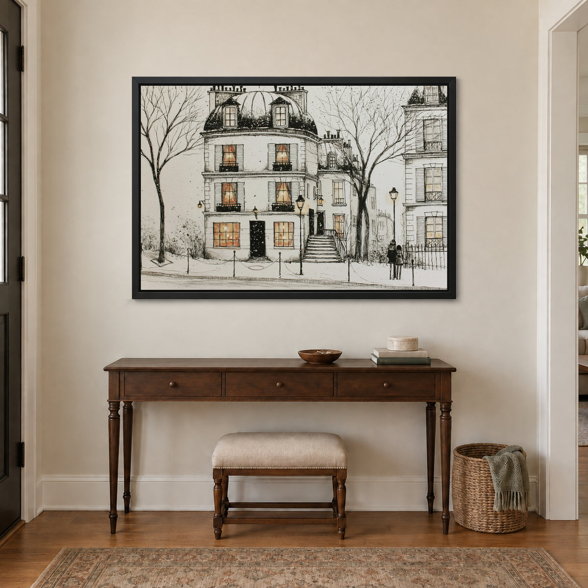 Paris Townhouse Snow framed canvas in a black floating frame above a dark wood console table and upholstered bench