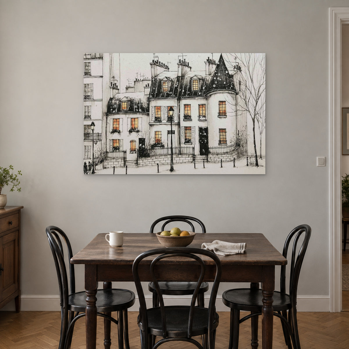 Paris Turret Rooftops Snow canvas wall art above a small wooden dining table with black bentwood chairs