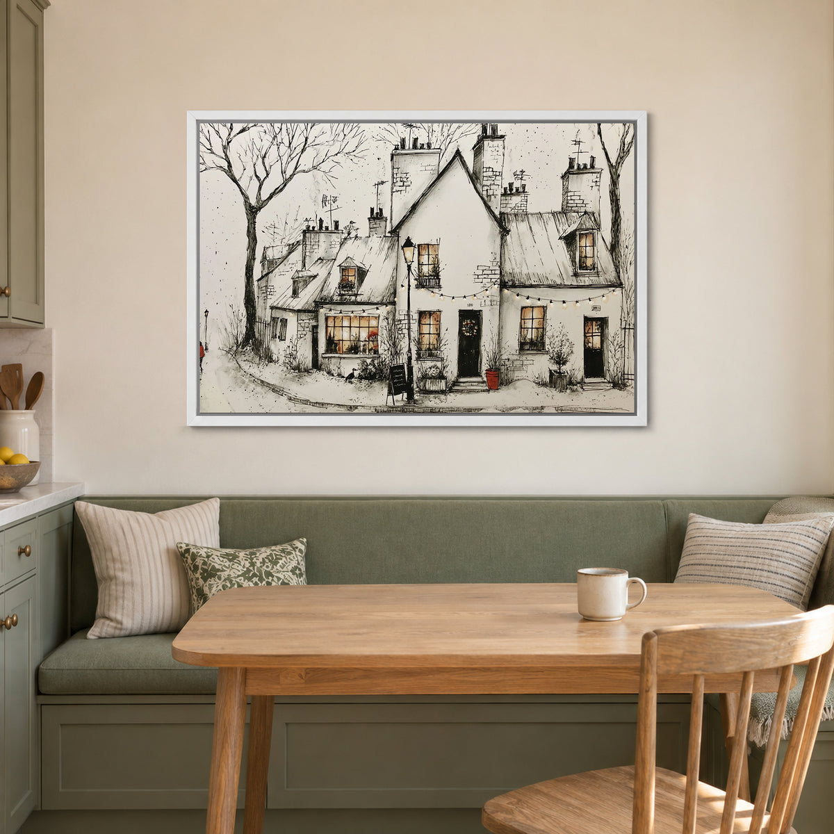 Paris Corner Cafe Snow framed canvas in a white floating frame above a green banquette and wooden table in a breakfast nook