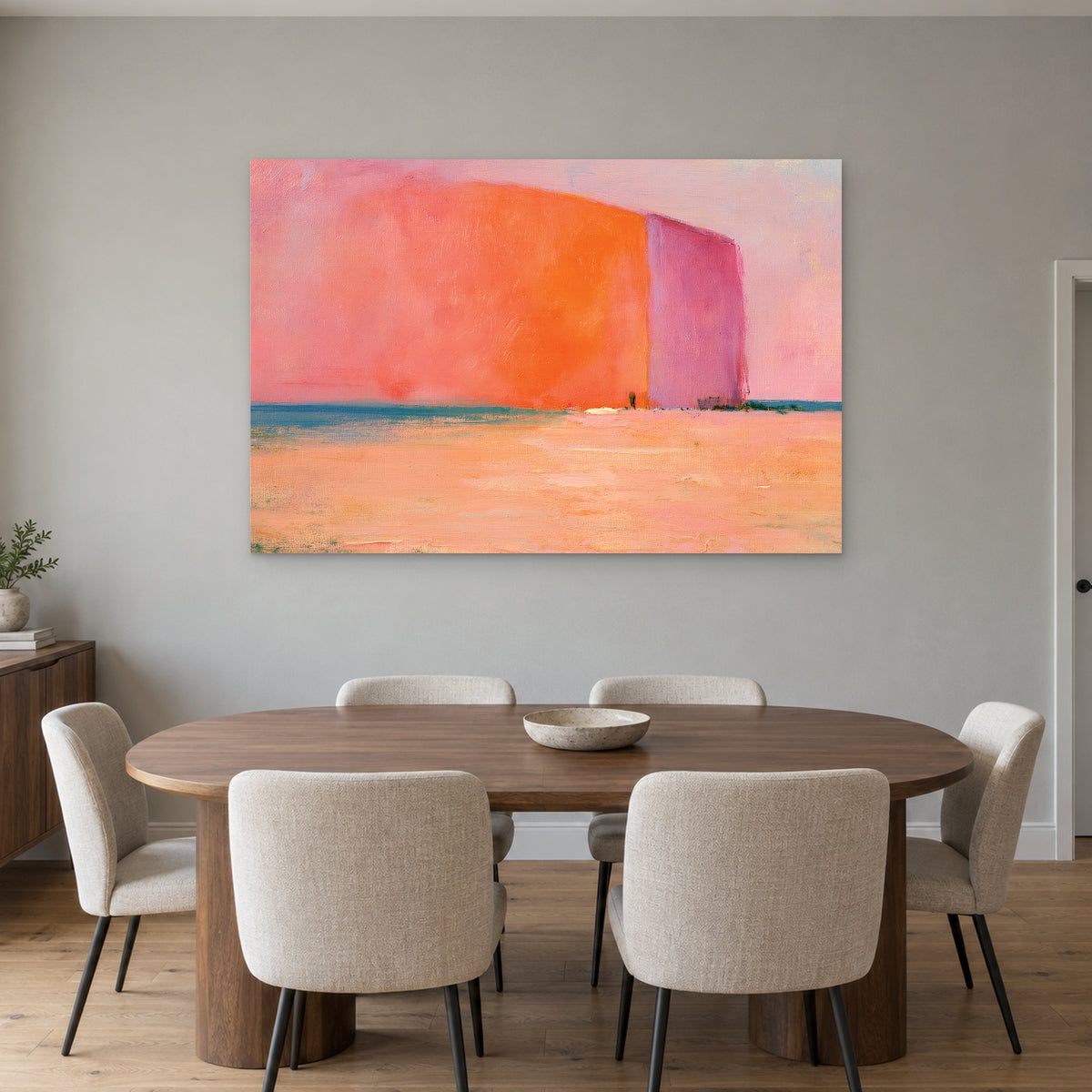 Minimalist Coral Block Horizon canvas wall art above an oval wooden dining table with cream upholstered chairs