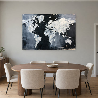 World Map Black and White canvas wall art above an oval wooden dining table with cream upholstered chairs