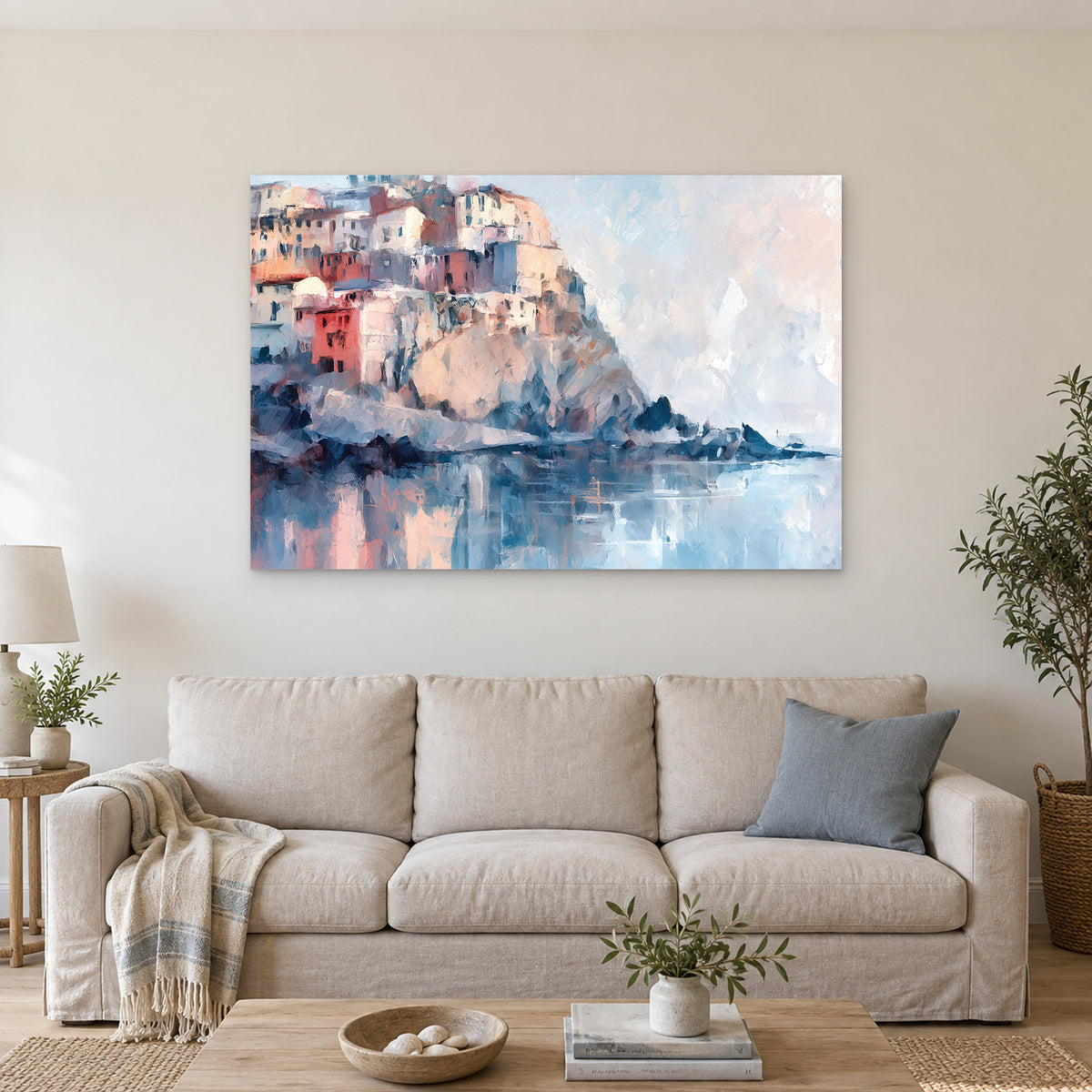 Cinque Terre Cliff Houses Coastal canvas wall art above a linen sofa with a blue cushion in a bright living room