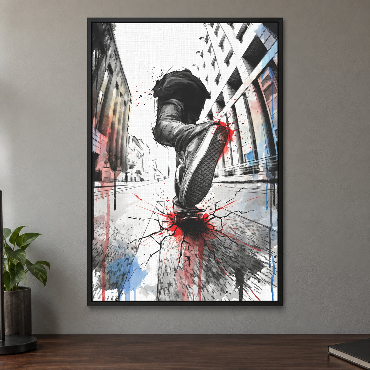Skateboard Street Trick framed canvas in a black floating frame on a taupe wall above a dark walnut sideboard with a potted plant