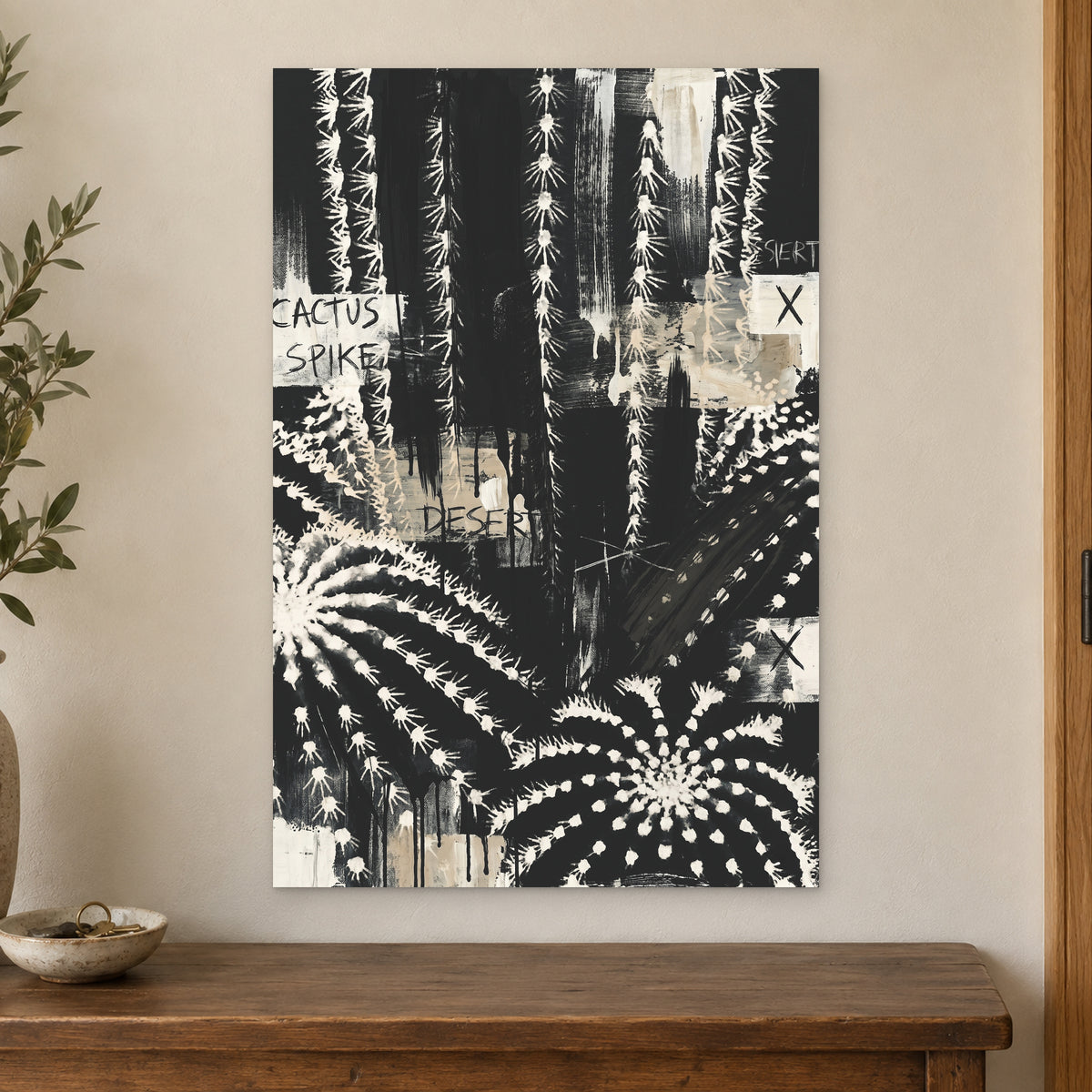 Black and White Cactus Desert canvas wall art on a cream wall above a wooden sideboard beside a door frame