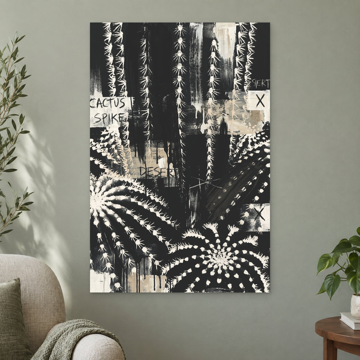 Black and White Cactus Desert canvas wall art on a sage green wall beside a cream armchair