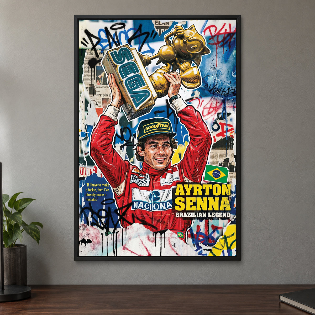 Ayrton Senna Trophy Pop Art framed canvas in a black floating frame on a taupe wall above a dark walnut sideboard with a potted plant
