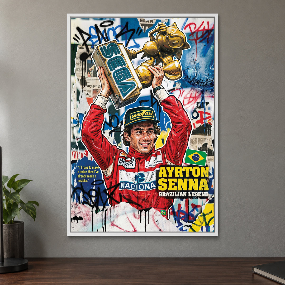 Ayrton Senna Trophy Pop Art framed canvas in a white floating frame on a taupe wall above a dark walnut sideboard with a potted plant
