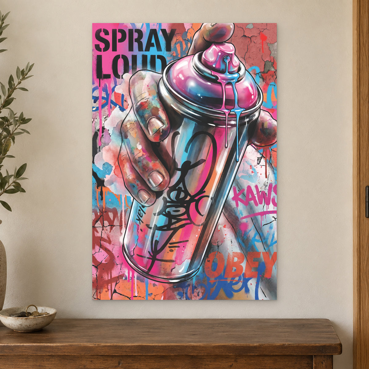 Spray Can Graffiti Street Art canvas wall art on a cream wall above a wooden sideboard beside a door frame