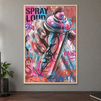 Spray Can Graffiti Street Art framed canvas in a natural wood floating frame on a taupe wall above a dark walnut sideboard with a potted plant