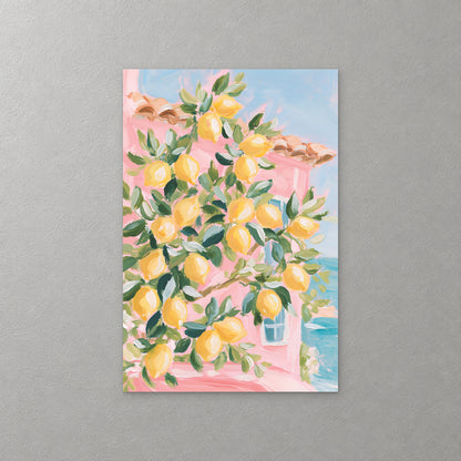 A lemon tree heavy with yellow fruit fills the frame in front of a pink house with a blue shutter, with a glimpse of turquoise sea at the right — canvas wall art print