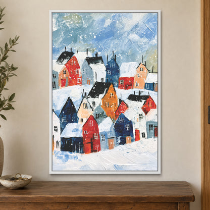Snowfall Over the Rooftops framed canvas in a white floating frame on a cream wall above a wooden sideboard beside a door frame