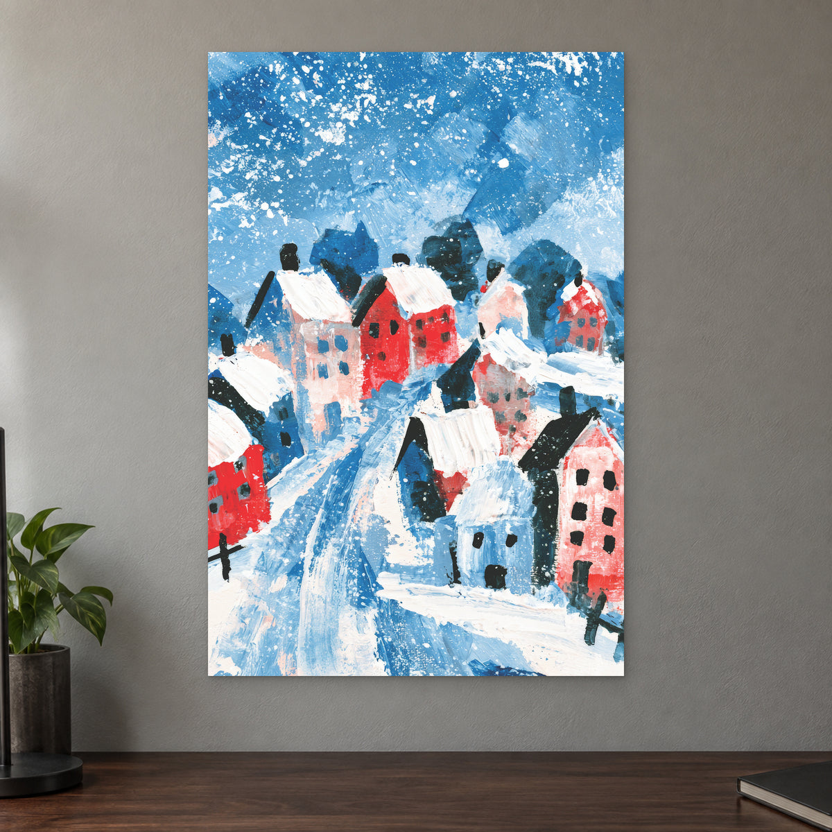 Winter Lane Between the Houses canvas wall art on a taupe wall above a dark walnut sideboard with a potted plant