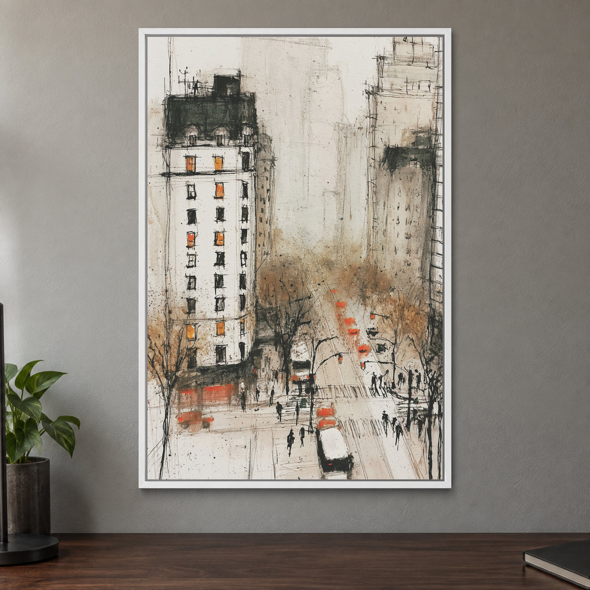 New York Cabs From Above framed canvas in a white floating frame on a taupe wall above a dark walnut sideboard with a potted plant