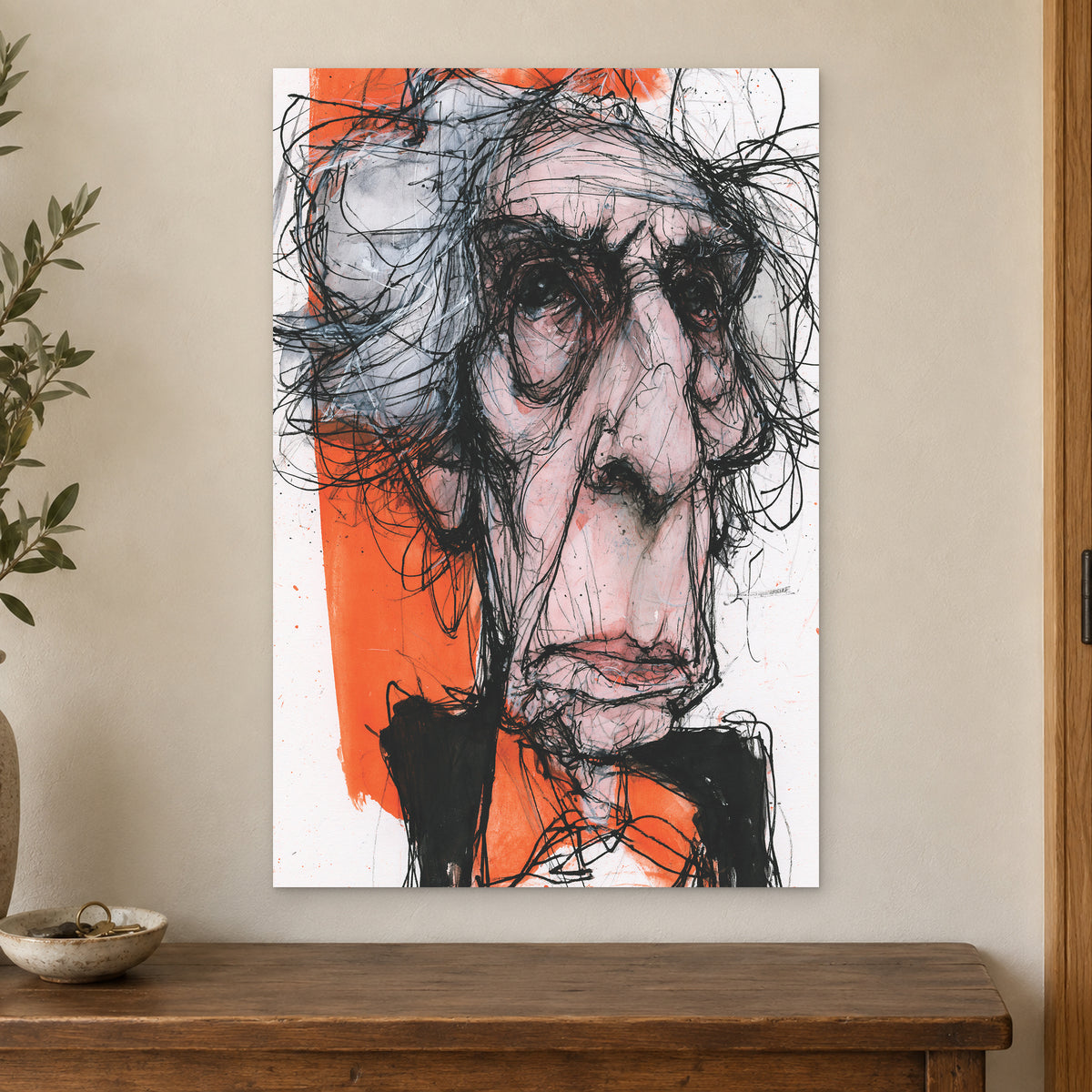 Wild Hair Scribble Portrait canvas wall art on a cream wall above a wooden sideboard beside a door frame